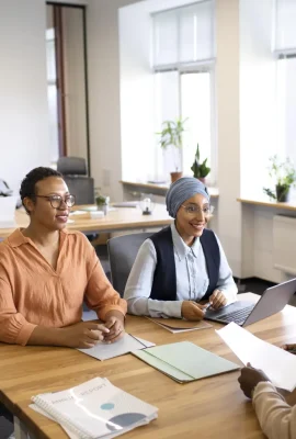 man-sitting-down-office-job-interview-desk-with-his-employers
